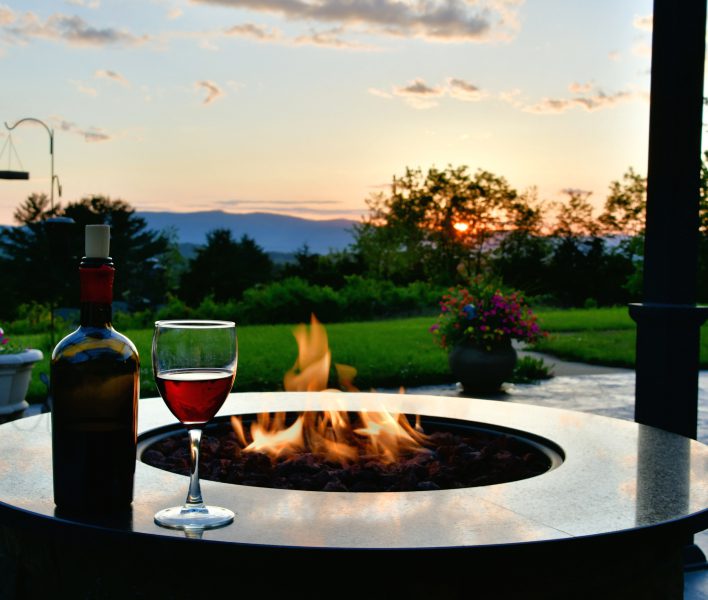 Relaxing at our new home sitting around a firepit, drinking wine, and taking in the stunning Idaho view.